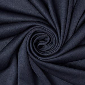 May include: Close-up of navy blue fabric with a swirling pattern. The fabric is tightly woven, with visible texture and a slight sheen. The folds create a spiral effect, highlighting the depth and texture of the material.