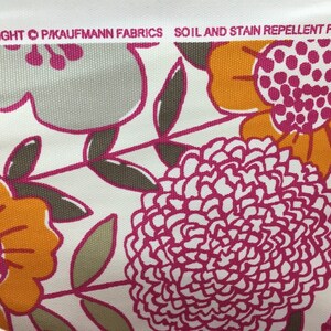 May include: White fabric with a floral pattern in shades of pink, orange, and gray. The fabric has a soil and stain repellent finish. The text "COPYRIGHT &copy; P.KAUFMANN FABRICS" is visible at the top of the image.