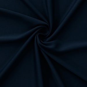 May include: A close-up shot of navy blue fabric with soft folds and a subtle sheen. The fabric is tightly woven, creating a smooth texture. The dark color and draping suggest a material suitable for clothing or home decor.