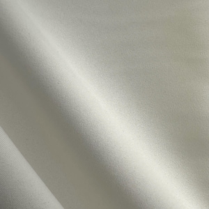 May include: A set of three ceramic mugs with a speckled, cream-colored glaze. Each mug features a different hand-painted design: a blue and green leaf, a yellow flower, and a red berry. The mugs have a simple, modern design.