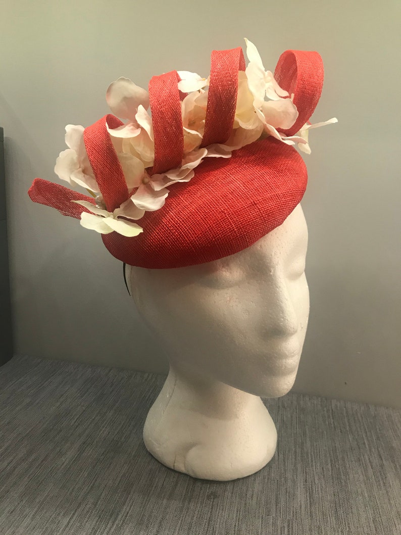Poppy red fascinator headpiece with floral pearl detail