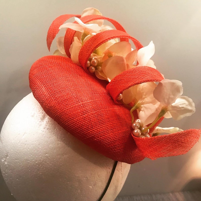 Poppy red fascinator headpiece with floral pearl detail