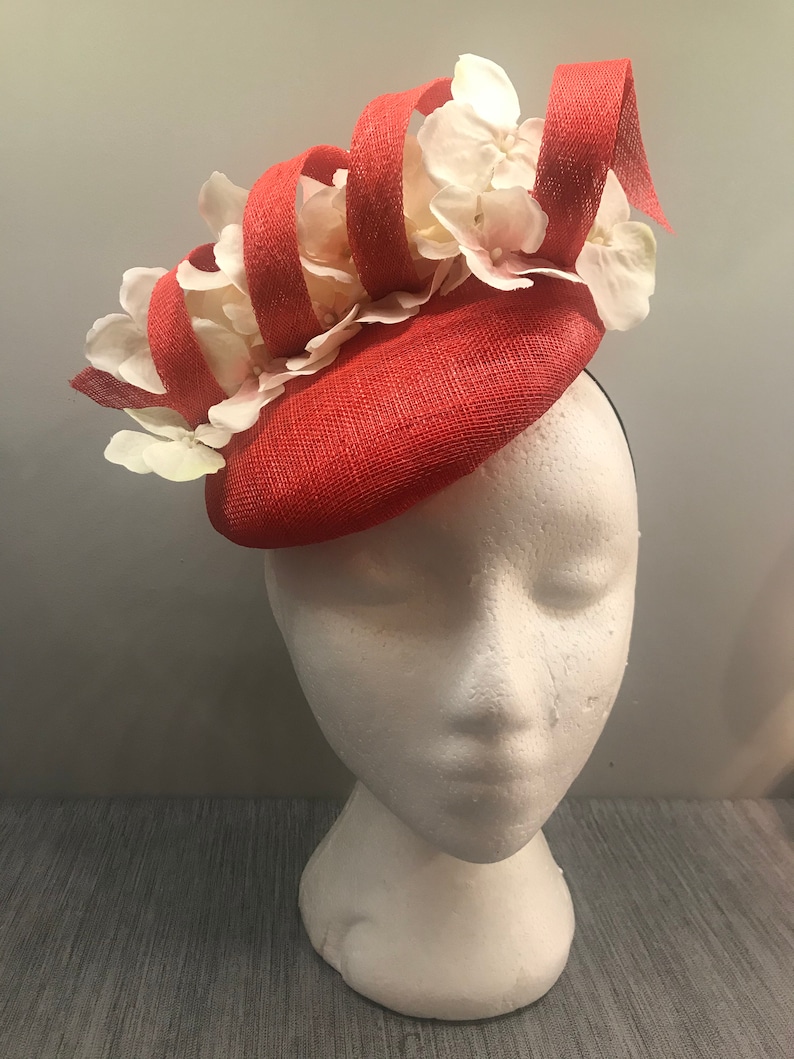 Poppy red fascinator headpiece with floral pearl detail
