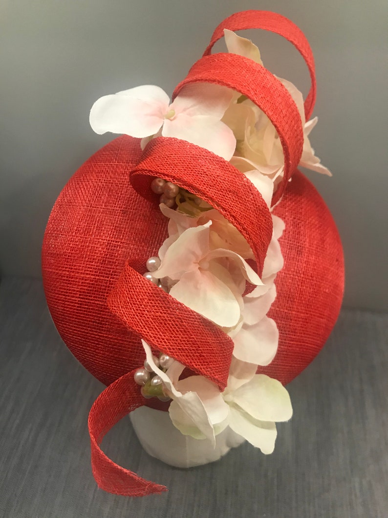 Poppy red fascinator headpiece with floral pearl detail