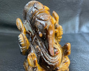 GANESH in TIGER EYE, a chic, humble and absolutely beautiful piece. Ganesha carved in Tiger Eye Stone, amazing collector piece.