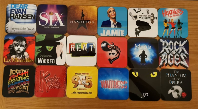 May include: A collection of 16 square coasters featuring various Broadway musical logos. The coasters are made of a hard, glossy material and feature colorful designs. Some of the musicals featured include Dear Evan Hansen, Six, Hamilton, The Book of Mormon, Heathers, Les Miserables, Wicked, Rent, Kinky Boots, 9 to 5, Waitress, Cats, The Phantom of the Opera, Matilda, Rock of Ages, and Joseph and the Amazing Technicolor Dreamcoat.