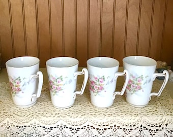 Lot of four bone china tall cups, chocolate cups, pink flowers