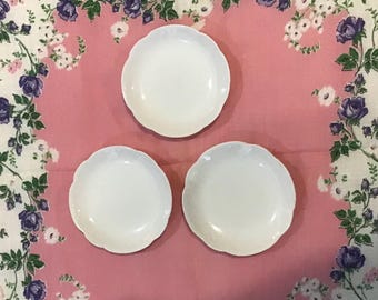 Lot of three butter pats, made in France, small white dishes