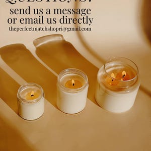 three candles sitting on top of a table next to each other