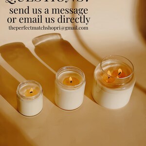 three candles sitting on top of a table next to each other