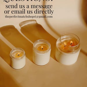 three candles sitting on top of a table next to each other