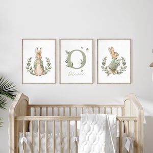 May include: Three framed prints with a green and white color scheme. The prints feature a rabbit, a letter O with greenery, and the name "Oliver".