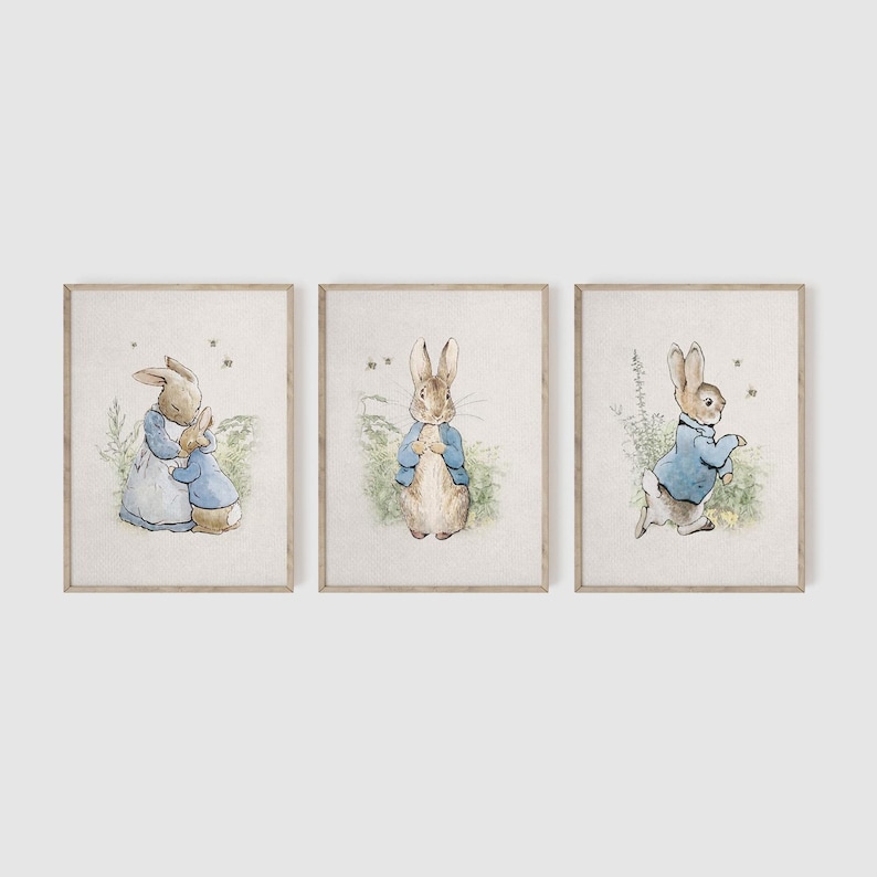 May include: Three framed prints featuring illustrations of Peter Rabbit. The first print shows Peter Rabbit hugging a smaller rabbit. The second print shows Peter Rabbit standing with his hands clasped in front of him. The third print shows Peter Rabbit walking away from the viewer.