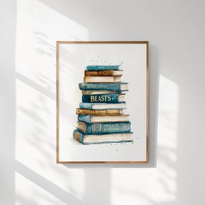 May include: Watercolor print of a stack of books in shades of blue, brown, and gold. The books have titles such as "Dark Arts," "Beasts," and "Potion Making." The artwork is framed in a wooden frame.