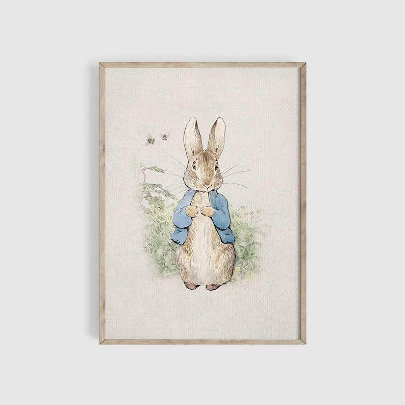 May include: A watercolor illustration of Peter Rabbit, a brown rabbit wearing a blue jacket, standing in a field of green grass. The rabbit is looking at the viewer with a curious expression.