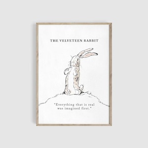 May include: A framed print featuring a watercolor illustration of a rabbit from "The Velveteen Rabbit." The rabbit is depicted in a seated position, with its ears perked up. The print includes the title and a quote: "Everything that is real was imagined first."