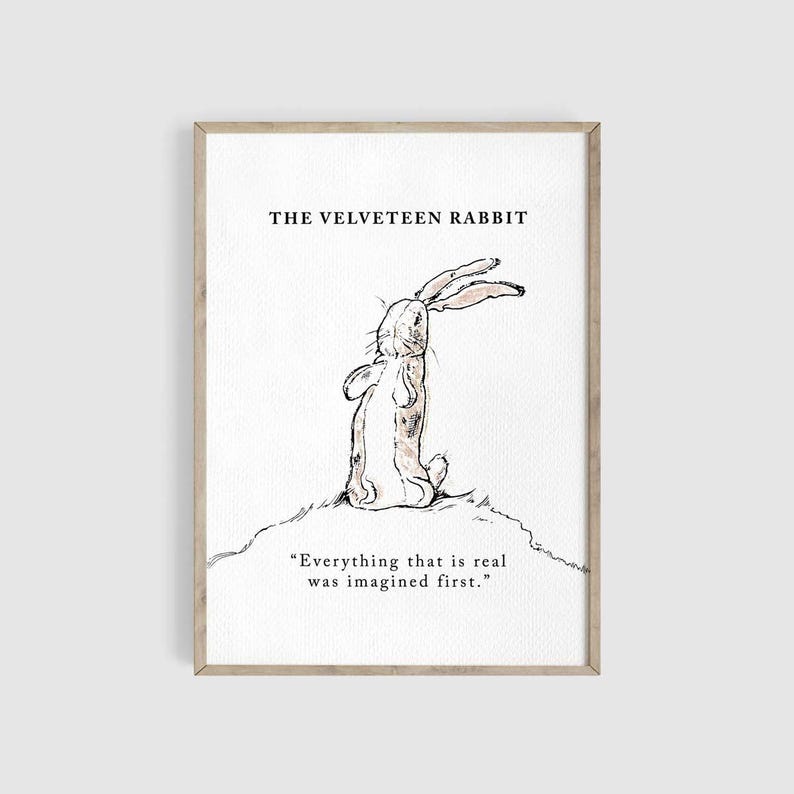 May include: A framed print featuring a watercolor illustration of a rabbit from "The Velveteen Rabbit." The rabbit is depicted in a seated position, with its ears perked up. The print includes the title and a quote: "Everything that is real was imagined first."