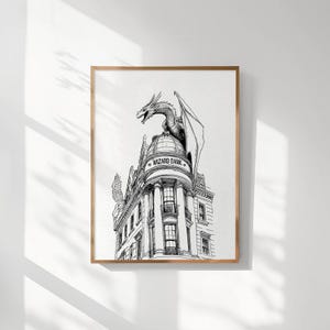 May include: A black and white illustration of a building with a dragon perched on top. The building has a sign that reads "Wizard Bank".