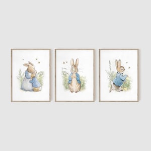 May include: Three framed illustrations of Peter Rabbit in different poses. The first shows Peter Rabbit hugging a smaller rabbit. The second shows Peter Rabbit standing with his hands clasped in front of him. The third shows Peter Rabbit walking with his right foot raised.