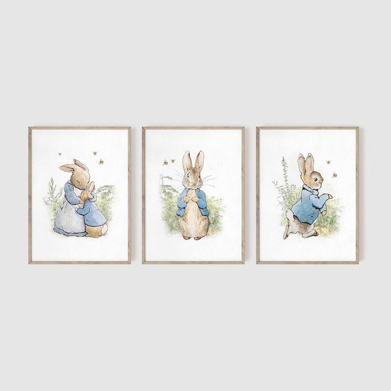 May include: Three framed illustrations of Peter Rabbit in different poses. The first shows Peter Rabbit hugging a smaller rabbit. The second shows Peter Rabbit standing with his hands clasped in front of him. The third shows Peter Rabbit walking with his right foot raised.