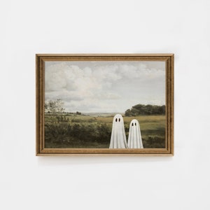 May include: A framed painting of a landscape with two white ghosts standing in a field. The painting is in a gold frame.