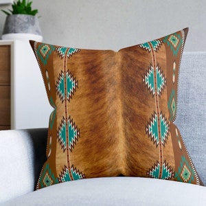 Western Brown faux cowhide print and turquoise tribal southwestern boho square throw pillow, the pillow cover is made of a faux suede fabric. Double sided print and comes in 3 sizes Includes pillow cover and pillow.