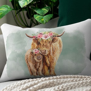 Western farmhouse farm floral highland cow and baby calf lumbar throw pillow, the casing is made of a spun polyester fabric that is inherently mildew and water-resistant. Double sided print and it is 14 X 20 inches. Includes cover and case