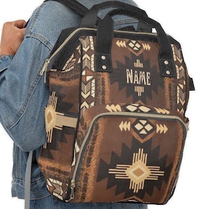 Personalized Brown and black southwestern tribal Indian boho western style diaper bag backpack. Custom monogrammed with your name or initials. Faux animal print backpack.