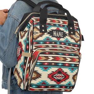 Personalized southwestern tribal turquoise boho western style diaper bag backpack. Custom monogrammed with your name or initials. Faux animal print backpack.