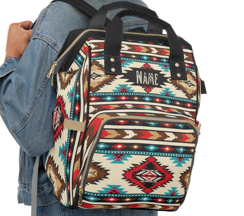 Personalized southwestern tribal turquoise boho western style diaper bag backpack. Custom monogrammed with your name or initials. Faux animal print backpack.