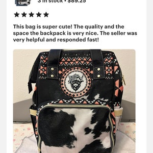 May include: Black and white cow print backpack with a pink and black geometric pattern. The backpack has a large main compartment and a smaller front pocket. The front pocket has a cow print design. The backpack has a black handle and a black zipper.