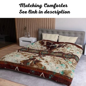 May include: A brown and white patterned bedspread with turquoise and red accents. The bedspread has a geometric design with diamonds and triangles. Matching comforter see link in description.