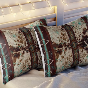 Western cowhide print with a boho southwestern tribal Indian and turquoise style pillow sham pillow covers. comes in two sizes.