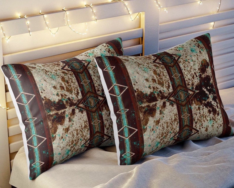 Western cowhide print with a boho southwestern tribal Indian and turquoise style pillow sham pillow covers. comes in two sizes.