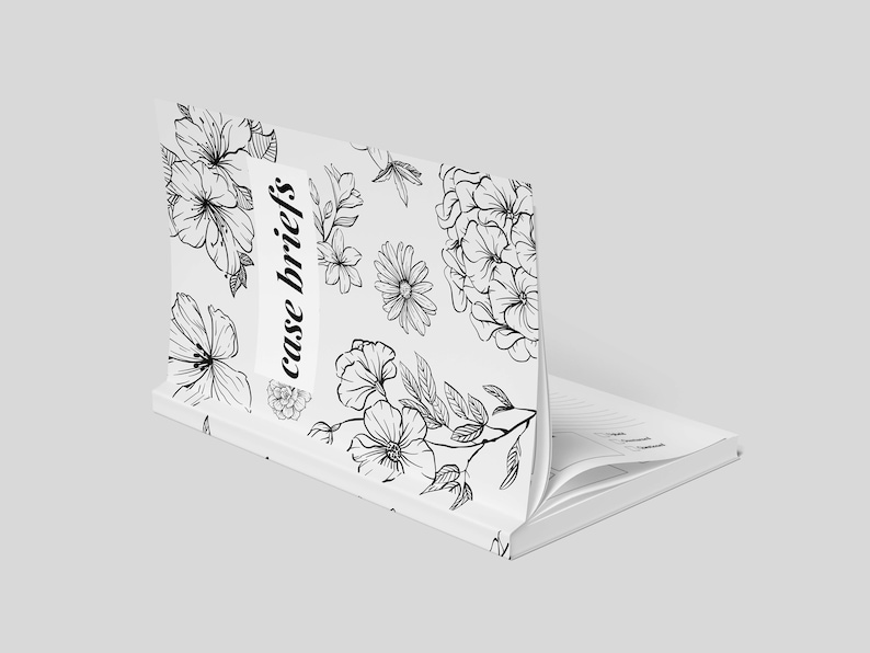 Puede incluir: Un cuaderno blanco con un dise&ntilde;o floral negro y el texto "case briefs" en la portada.
