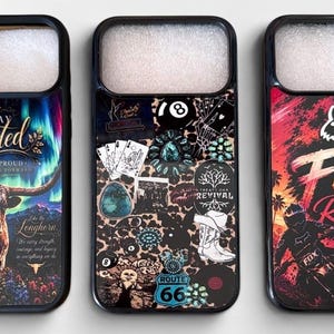 May include: Three phone cases with unique designs. One features a longhorn with text that reads "Stay Rooted". Another has a collage of images including playing cards and a Route 66 sign. The third case displays "Fox Racing" with a motocross rider.