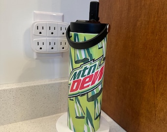 New  22oz tumbler, with flip straw. “Mountain Dew” holds ice 24 hours