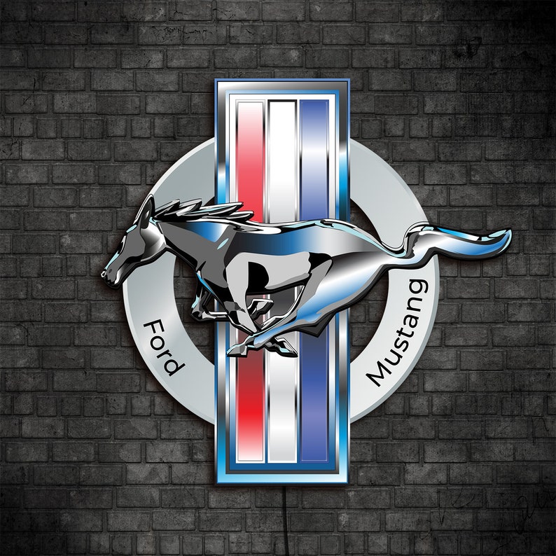 May include: A silver Ford Mustang logo with a running horse, red, white, and blue stripes, and the words "Ford" and "Mustang" in a circle.