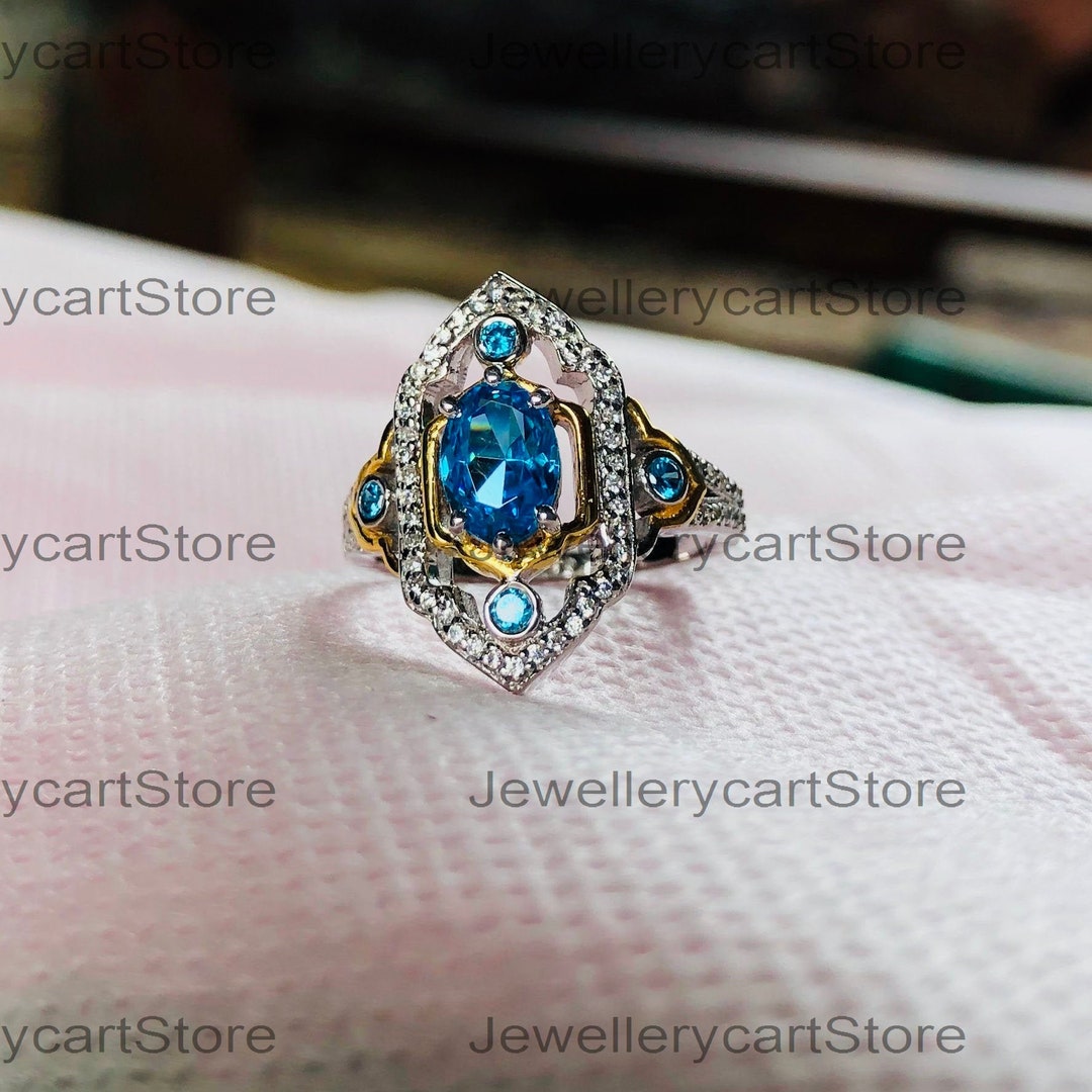 Enchanted Jasmine Oval Swiss Blue Topaz and 1/5 CT. T.W. Diamond