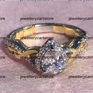 Enchanted Disney Rapunzel 0.90 CT T.W. White Pear Cut Simulated Diamond Twist Shank Engagement Ring Stering Silver Two-Tone Rhodium Plating