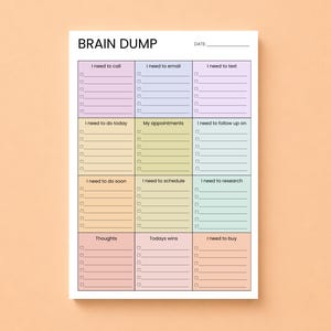 May include: A white Brain Dump notepad with sections for tasks like calls, emails, and appointments. The notepad has a pastel colour scheme with sections labelled "I need to call," "I need to email," and "I need to text."