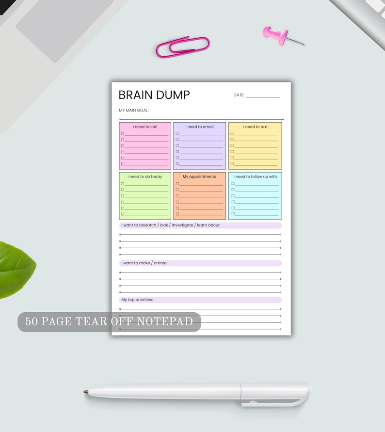May include: A 50 page tear off notepad titled BRAIN DUMP with a date line and a main goal section. It features six colorful boxes for tasks like I need to call, email, text, do today, appointments, and follow up with, plus lined sections.
