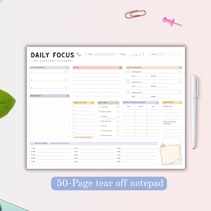 May include: A rectangular daily planner notepad with the text DAILY FOCUS and MY EVERYDAY PLANNER. The layout includes sections for top priorities, notes, focus sessions, brain dump, tasks, self-care, contacts, reflection, and time blocking.