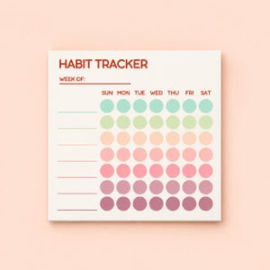 May include: A square habit tracker notepad with white paper and red text reading HABIT TRACKER and WEEK OF. It features seven rows of seven colored circles in a gradient from mint green to light green, peach, pink, and dark purple, with lines.