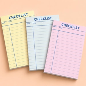 May include: Three rectangular checklist notepads in pastel yellow, light blue, and soft pink. Each pad features the word CHECKLIST printed in dark blue at the top, with horizontal lines and columns labeled DATE and TITLE for organized task tracking.