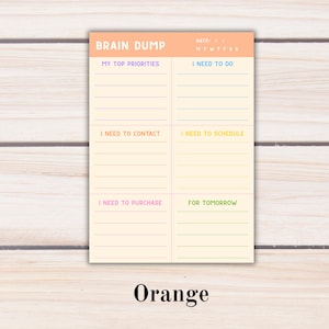 May include: A rectangular paper planner sheet with an orange header labeled BRAIN DUMP and a date section. The cream-colored body is divided into six sections with colored headings: MY TOP PRIORITIES, I NEED TO DO, I NEED TO CONTACT, I NEED TO SCHEDULE, I NEED TO PURCHASE, and FOR TOMORROW, each with horizontal lines.