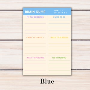 May include: A rectangular paper planner sheet with a light blue header labeled BRAIN DUMP and a date section. The cream-colored body features six categorized sections with lines for writing: MY TOP PRIORITIES, I NEED TO DO, I NEED TO CONTACT, I NEED TO SCHEDULE, I NEED TO PURCHASE, and FOR TOMORROW.