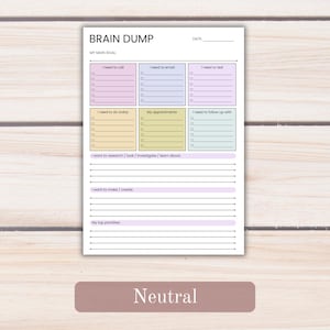 May include: A white paper planner page titled BRAIN DUMP with a date line and MY MAIN GOAL section. It features six colored boxes for tasks like I need to call and My appointments, plus lined sections for research, creation, and priorities.