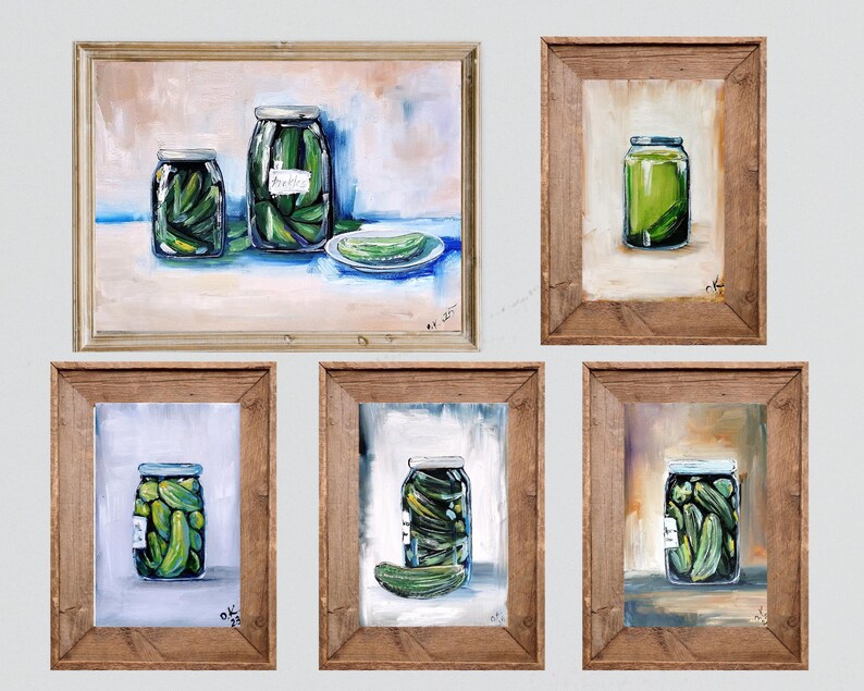 May include: A collection of five framed art pieces featuring still-life paintings of jars filled with pickles. The paintings showcase the pickles in a variety of compositions, with wooden frames and a neutral background.