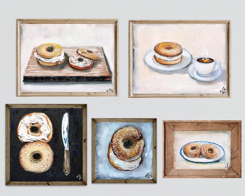 May include: A collection of five framed paintings depicting bagels. The paintings feature bagels with cream cheese, a knife, and a cup of coffee. The artwork is in a rustic style with a neutral color palette, perfect for kitchen or dining room decor.